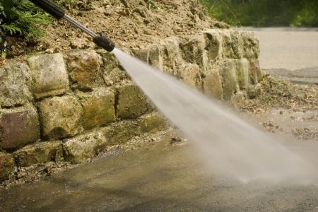 How Improper Pressure Washing Can Damage Landscaping